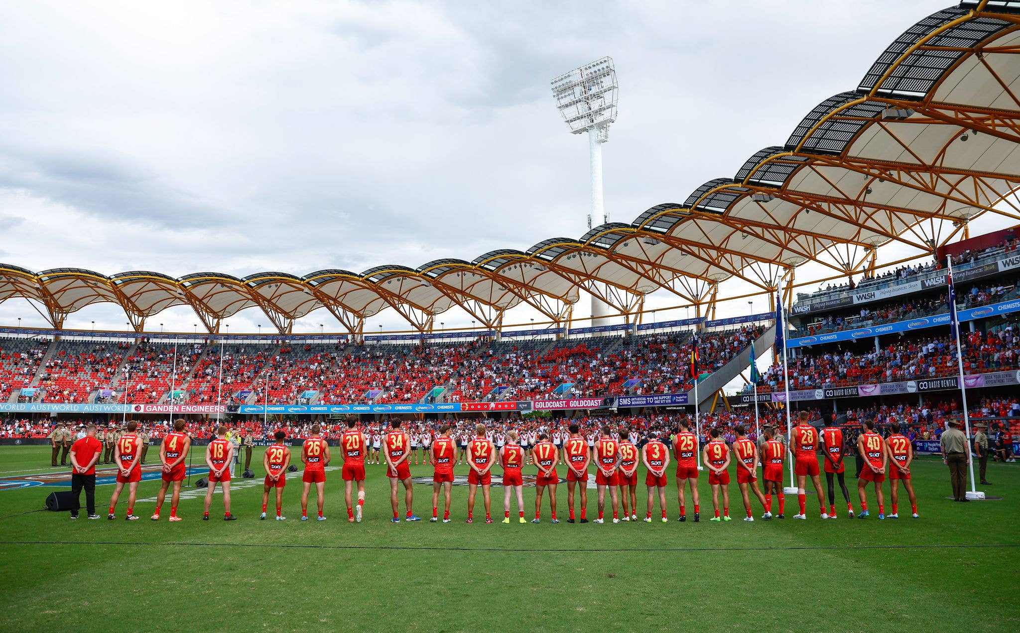 GOLD COAST, AUSTRALIA - APRIL 27: An ANZAC ceremony is seen during the 2025 AFL Round 07 match between the Gold Coast Suns and the Sydney Swans at People First Stadium on April 27, 2025 in the Gold Coast, Australia. (Photo by Russell Freeman/AFL Photos)